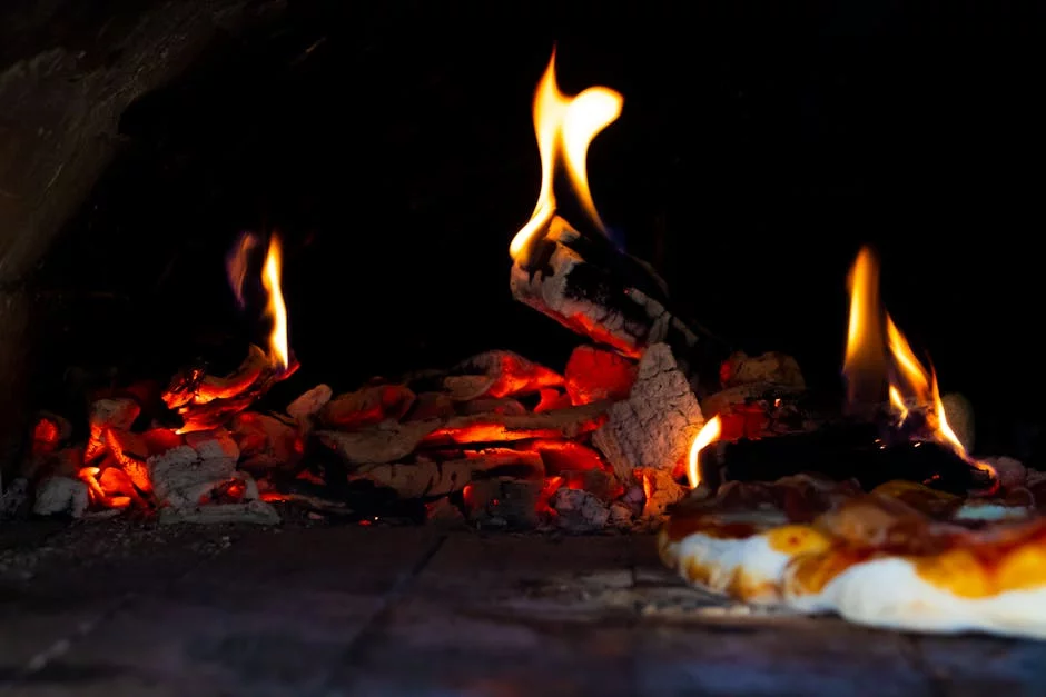 wood fired pizza oven flames glowing