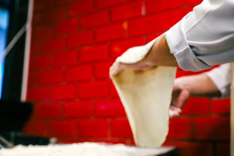pizza chef kneading dough hands flour